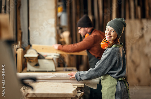 Canvas Print Man and woman working in carpentry workshop
