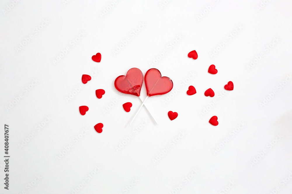 two red Valentine's day heart shape lollipop candy on empty white paper background. Love Concept. top view. Minimalism colorful hipster style. banner