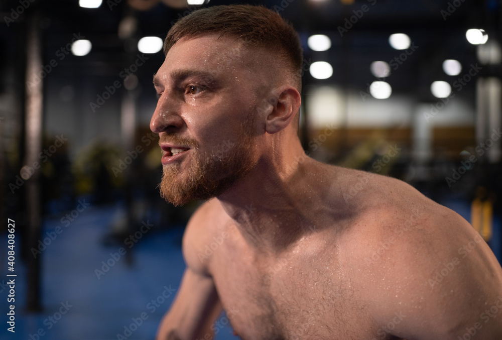 Sweaty sportsman doing snatch exercise Sweaty sportsman doing snatch exercise