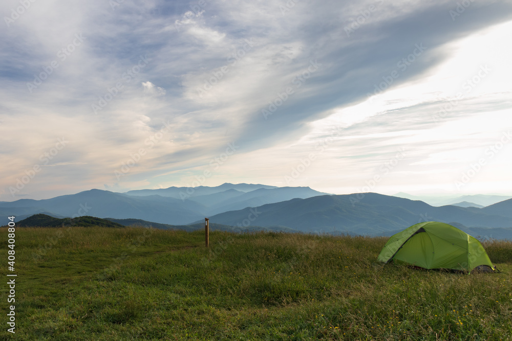 Green tent on Max Patch bald at sunset