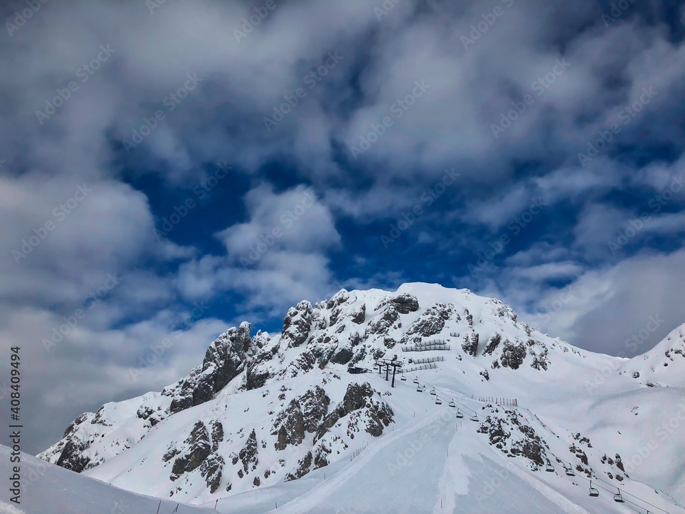 Snowy Mountain in European Alps. Snow Covered Rock on a Cloudy Day in Austria. Snowy Mountain in European Alps. Snow Covered Rock on a Cloudy Day in Austria.