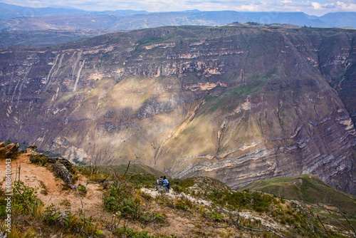 Lovers enjoying the view into the Huanca Urco Canyon at Huancas, Chachapoyas, Amazonas, Peru photo