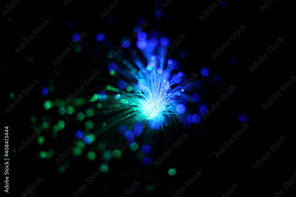 Bokeh of colorful, defocused lights and wires with black background. Fireworks, explosion of colorful lights.