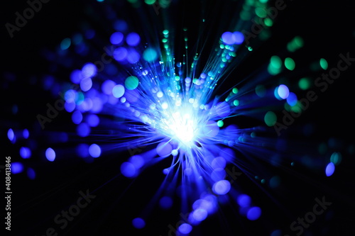 Bokeh of colorful, defocused lights and wires with black background. Fireworks, explosion of colorful lights.
