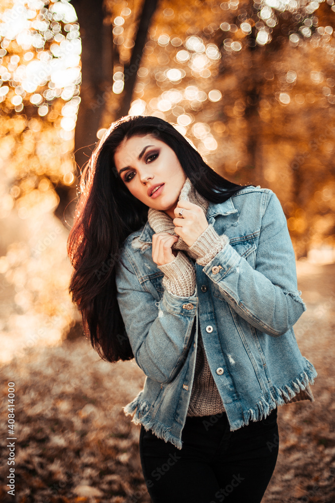 Beautiful model posing for the camera in the park. Beautiful model posing for the camera in the park.