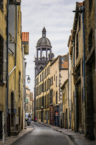 View on Notre Dame de Mathuret church bell tower from Harp street in Riom  a small town in Auvergne  France 