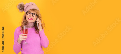 woman with mobile phone and glass of wine isolated