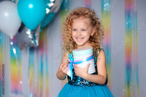 happy Birthday! happy child girl in elegant dress