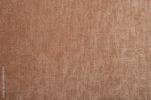 The texture of coarse brown fabric is used for upholstery of rustic furniture.