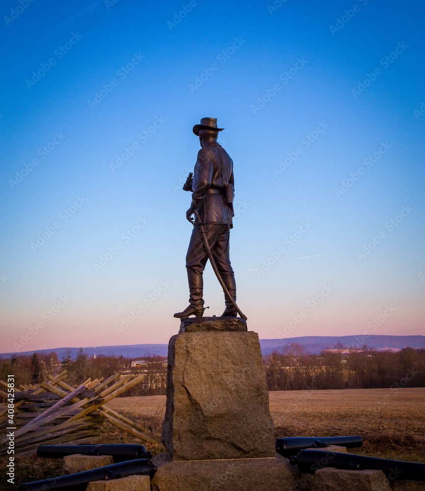 solider statue at sunrise in Gettysburg