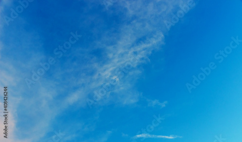 White clouds in a blue sky background