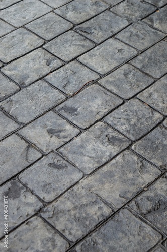 Bandung, Indonesia - This is a sidewalk. Box-patterned and stone-based