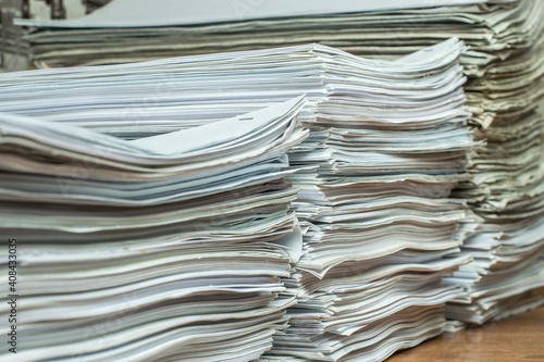 bundles bales of paper documents. stacks packs pile on the desk in the office