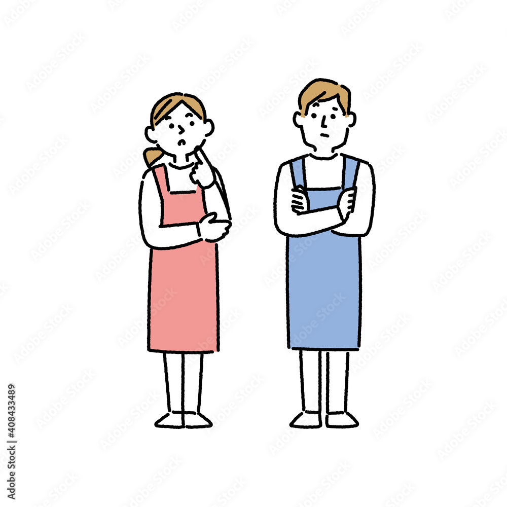 腕組みをし考えているエプロン姿の男女 腕組みをし考えているエプロン姿の男女