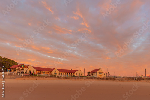 Beautiful winter's sunrise over Nobbys  Surf Club and Pavilion. Nobbys  Beach , Newcastle, Hunter Valley , N.S.W. Australia.