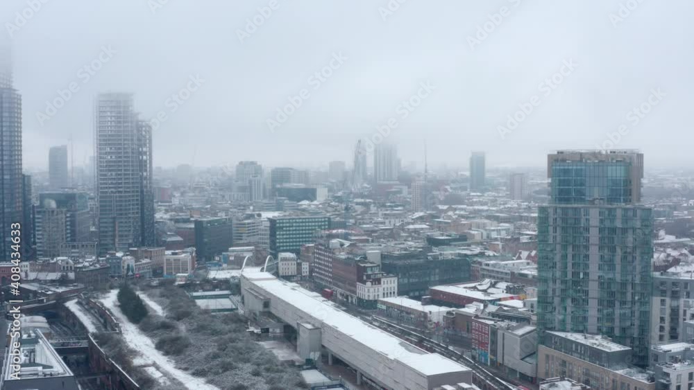 Drone shot towards shoreditch highstreet London covered in Snow Drone shot towards shoreditch highstreet London covered in Snow