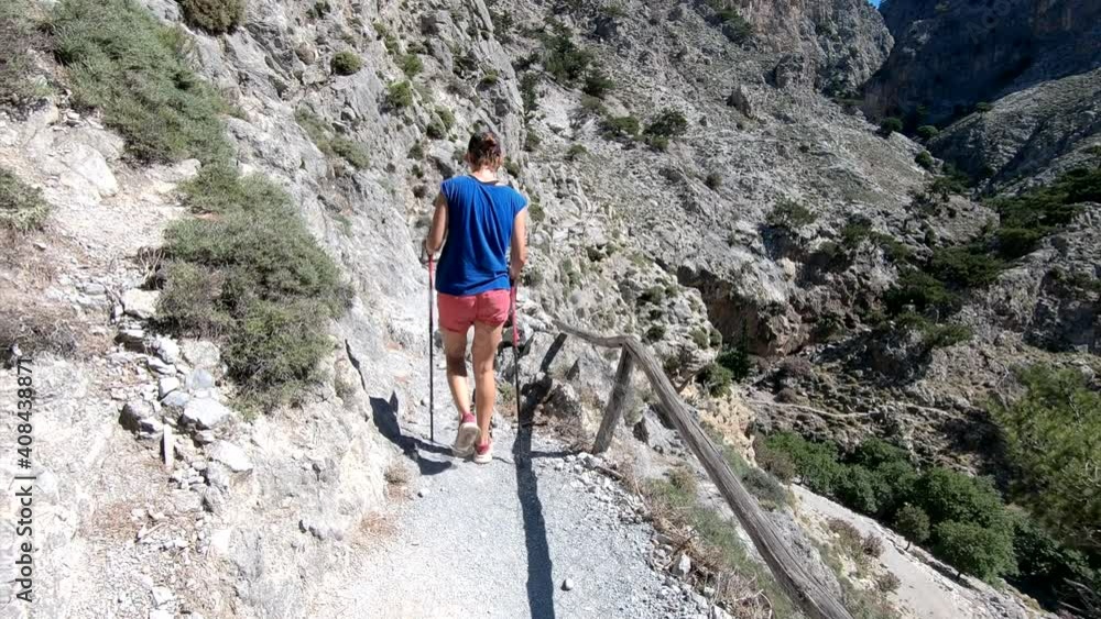 Summer adventure. Young woman walks in mountain and has fun. Holiday concept Summer adventure. Young woman walks in mountain and has fun. Holiday concept