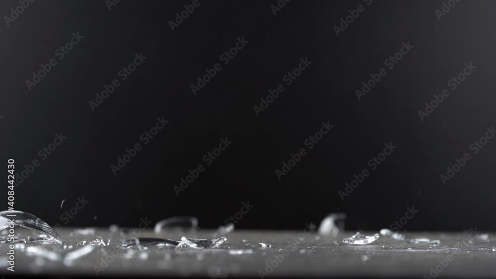 Slow motion view of wineglass falling and shattering Slow motion view of wineglass falling and shattering