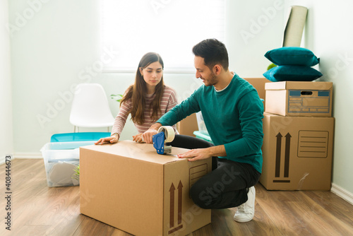 Hispanic man and his girlfriend moving out of an apartment