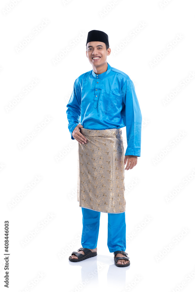 Fototapeta premium full lenght portrait of malaysia male with blue traditional satin clothes over white background