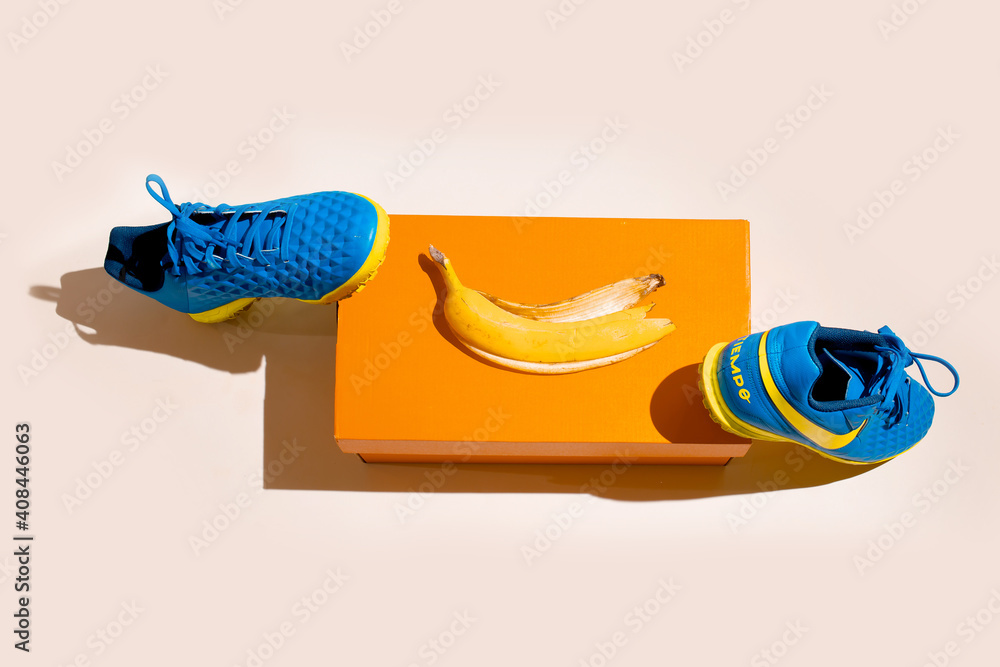 Kiev, Ukraine - January 26, 2021: Nike sports shoes for men. Blue sneakers  near the orange box. Creative composition Stock Photo | Adobe Stock