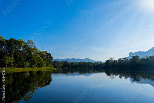 Wide angle view  natural landscape with river and mountain and sky.