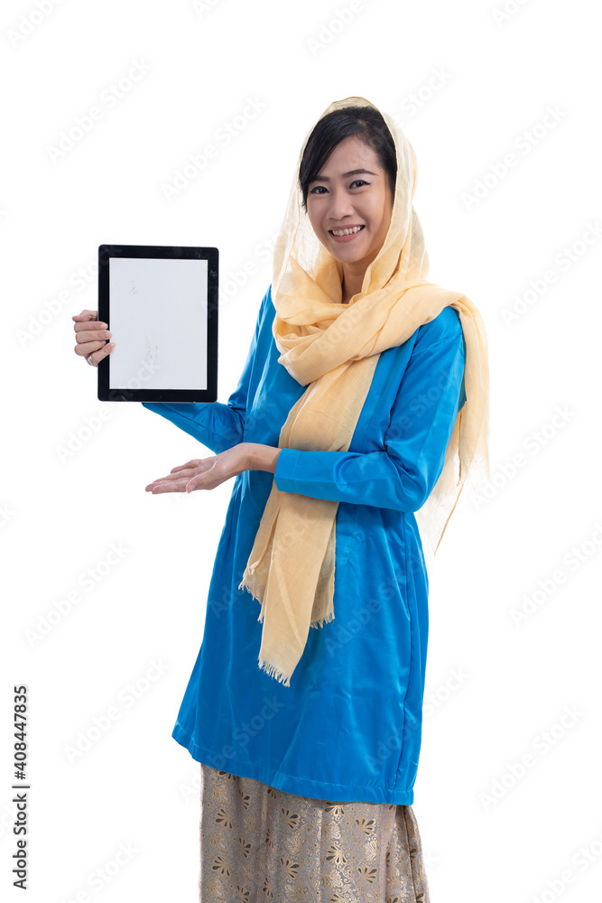 muslim woman showing her tablet pc screen isolated over white muslim woman showing her tablet pc screen isolated over white