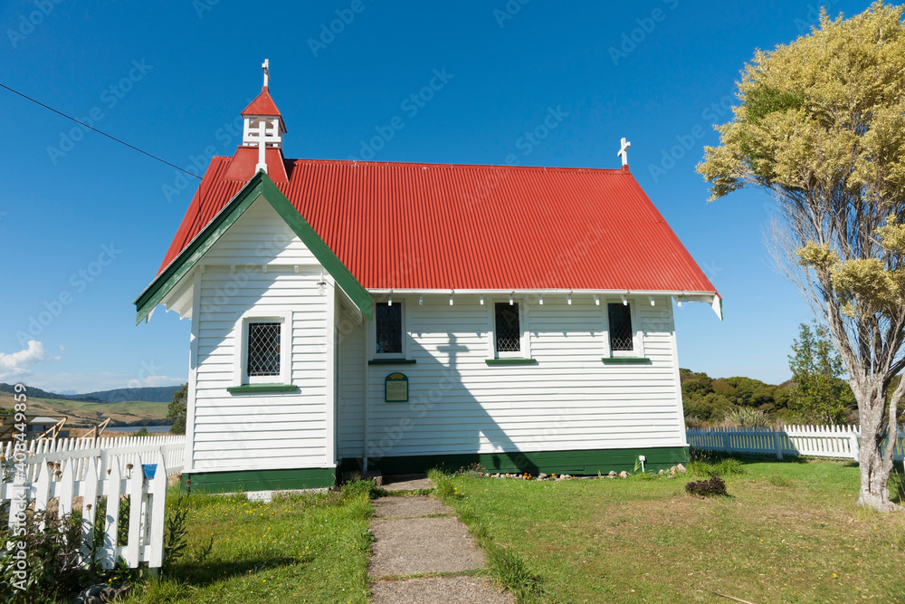 Old traditional design St Mary's Anglican Church in Waikawa with red roof and white exterior.