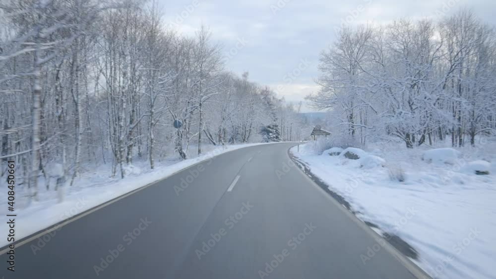 Driving in beautiful winter scenery in Germany. Fresh snow in scenic mountain landscape in Germany similar to the alps in Switzerland and Austria. Traffic in Europe. Driving in beautiful winter scenery in Germany. Fresh snow in scenic mountain landscape in Germany similar to the alps in Switzerland and Austria. Traffic in Europe.