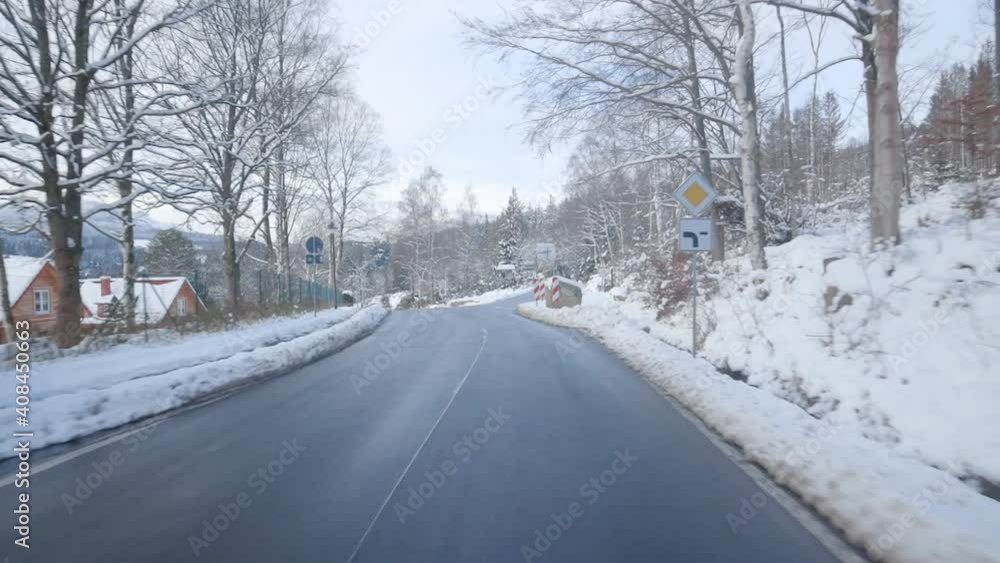 Driving in beautiful winter scenery in Germany. Fresh snow in scenic mountain landscape in Germany similar to the alps in Switzerland and Austria. Traffic in Europe. Driving in beautiful winter scenery in Germany. Fresh snow in scenic mountain landscape in Germany similar to the alps in Switzerland and Austria. Traffic in Europe.