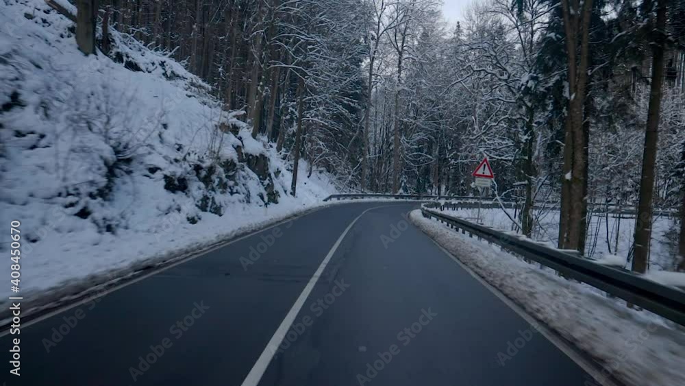 Driving in beautiful winter scenery in Germany. Fresh snow in scenic mountain landscape in Germany similar to the alps in Switzerland and Austria. Traffic in Europe. Driving in beautiful winter scenery in Germany. Fresh snow in scenic mountain landscape in Germany similar to the alps in Switzerland and Austria. Traffic in Europe.