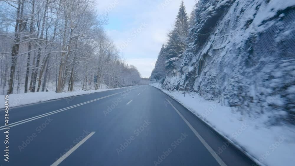 Driving in beautiful winter scenery in Germany. Fresh snow in scenic mountain landscape in Germany similar to the alps in Switzerland and Austria. Traffic in Europe. Driving in beautiful winter scenery in Germany. Fresh snow in scenic mountain landscape in Germany similar to the alps in Switzerland and Austria. Traffic in Europe.