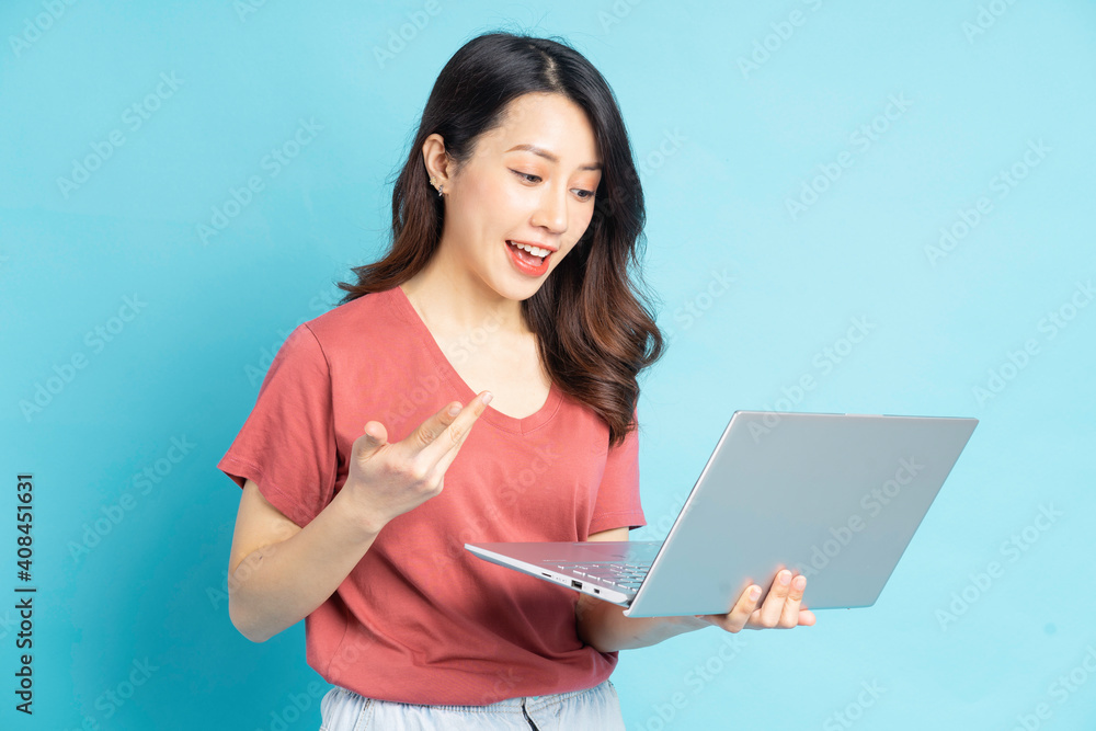 Beautiful Asian woman using laptop to video call with friends Beautiful Asian woman using laptop to video call with friends