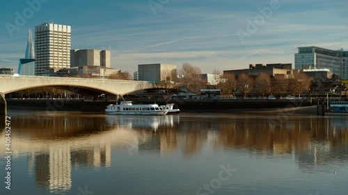 Slow panning view of the Waterloo Bridge and the Thames in London, England, UK on a bright sunny day photo