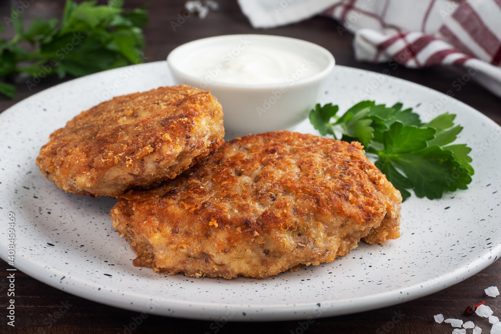 Buckwheat cutlets with cheese and parsley on a plate. Healthy diet food Buckwheat cutlets with cheese and parsley on a plate. Healthy diet food