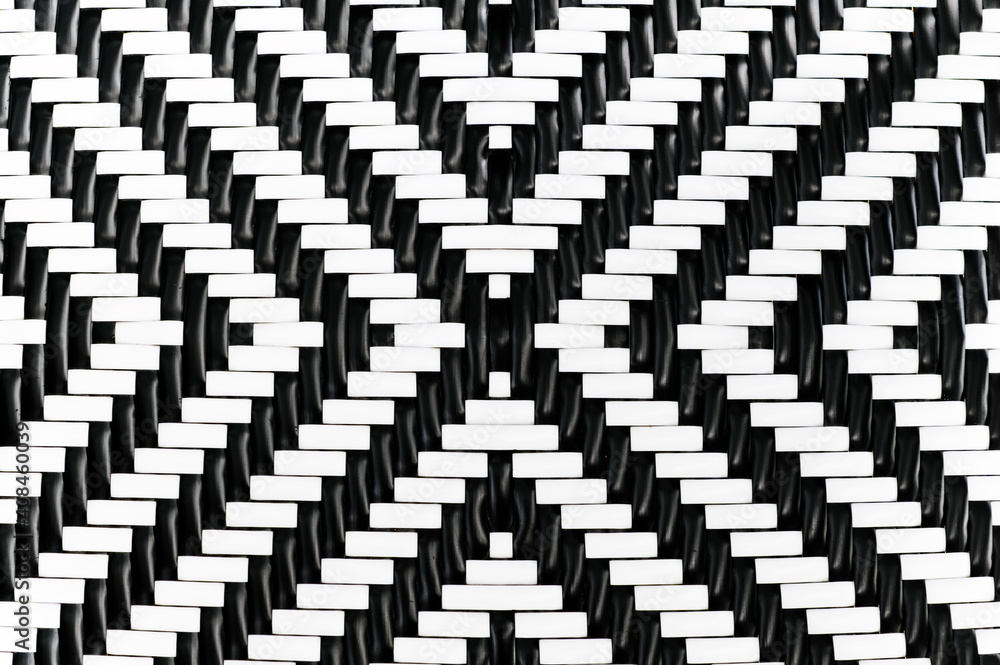 abstract background of pattern of black and white plastic handcraft weave design for texture