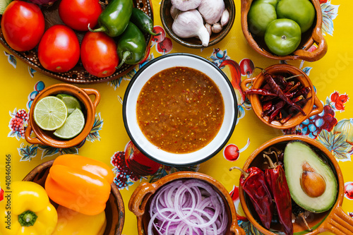 Bild auf Leinwand mexican salsa spicy sauce and ingredients on a table kitchen in Mexico city, Top view copy space