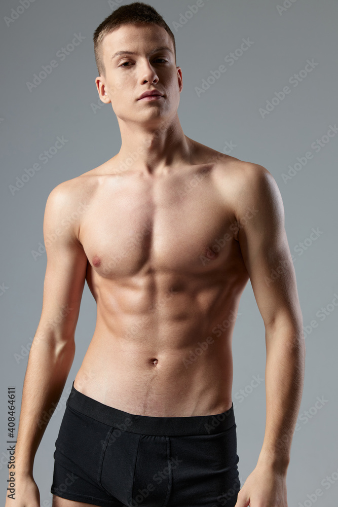 athletic man with pumped up muscular abs gymnasium isolated background athletic man with pumped up muscular abs gymnasium isolated background