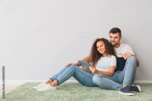 Young couple with tablet co...