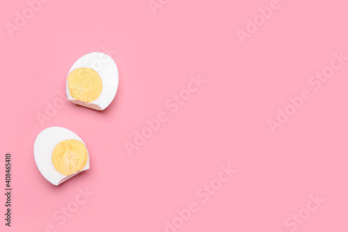 Tasty boiled egg on color background