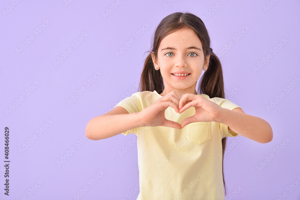 Cute little girl making heart with her hands on color background Cute little girl making heart with her hands on color background