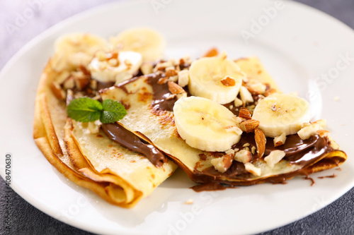crepe with chocolate and banana with nuts