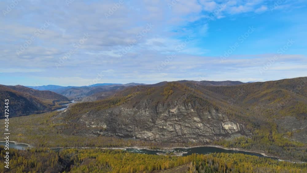 beautiful panorama of the mountains, and the river valley, along the banks of the autumn forest, wild nature, Republic of Tuva, Russia beautiful panorama of the mountains, and the river valley, along the banks of the autumn forest, wild nature, Republic of Tuva, Russia