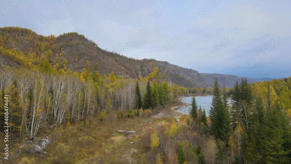 flight over a wide mountain range, beautiful mountains and a beautiful autumn forest, Republic of Tuva, Russia flight over a wide mountain range, beautiful mountains and a beautiful autumn forest, Republic of Tuva, Russia