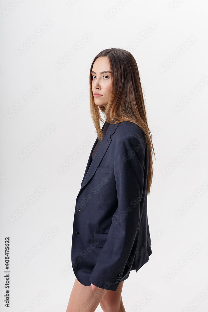 portrait of young attractive asian woman with long brown hair wearing blue suit isolated on white studio background. skinny pretty female posing on cyclorama. model tests of beautiful lady portrait of young attractive asian woman with long brown hair wearing blue suit isolated on white studio background. skinny pretty female posing on cyclorama. model tests of beautiful lady
