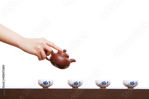 A hand in pouring tea closeup photo