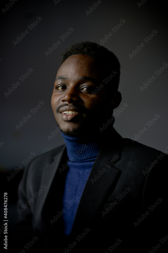 Retro african business man in black suit. Low key style Retro african business man in black suit. Low key style