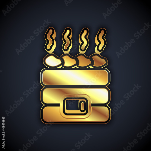 Gold Hot sauna stones icon isolated on black background. Spa resort recreation, bathhouse relaxation. Hot stones on electric heater. Vector.