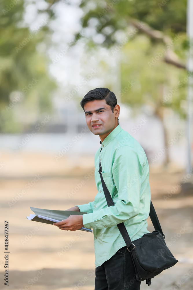 Young indian college student or job seeker with Holding file in Hand.