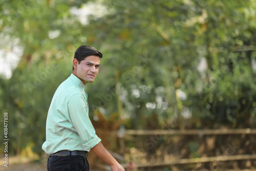 Young handsome indian man giving expression
